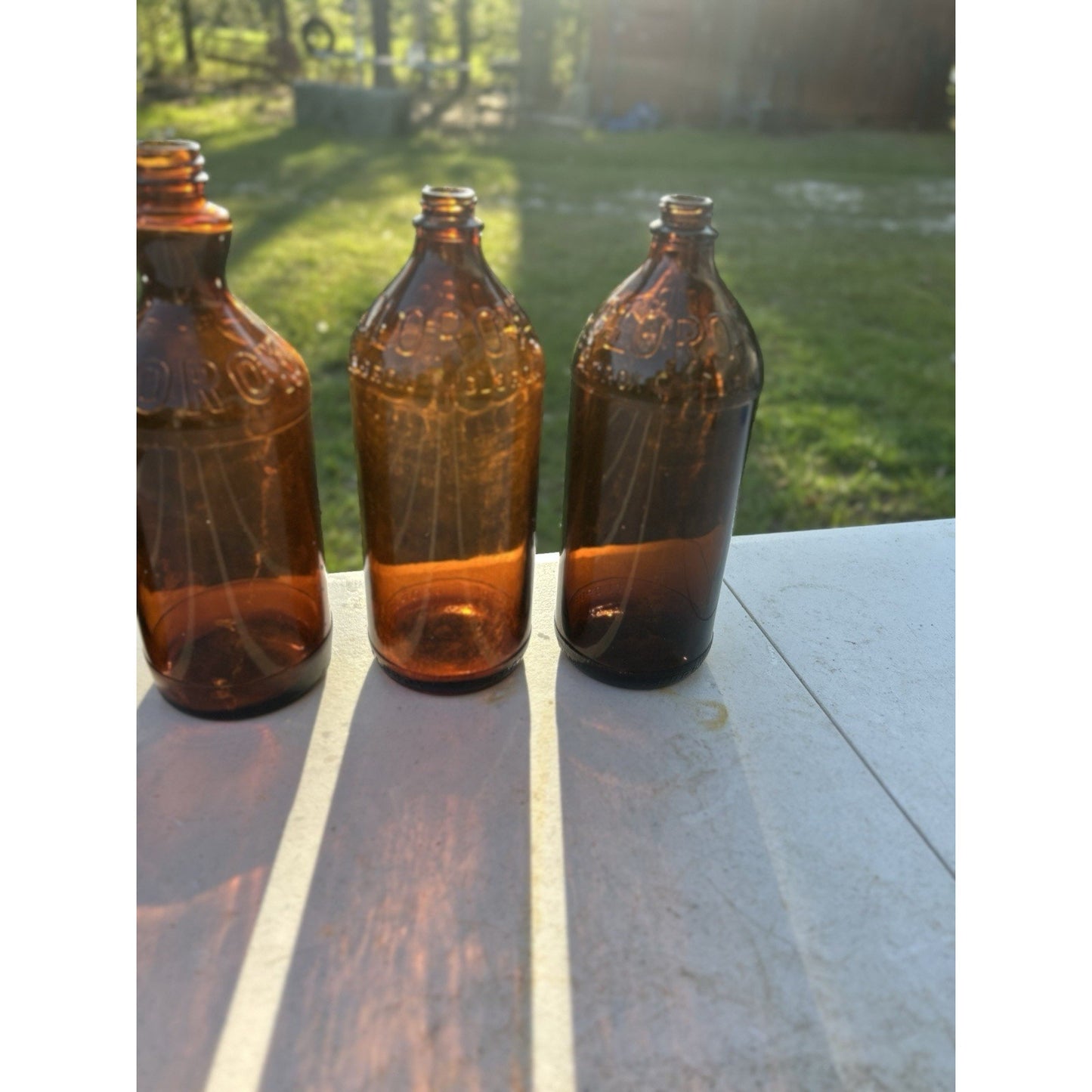 Vintage Clorox Glass Bottle Collection — Five Bottles — 1932–1955 — Amber & Brown