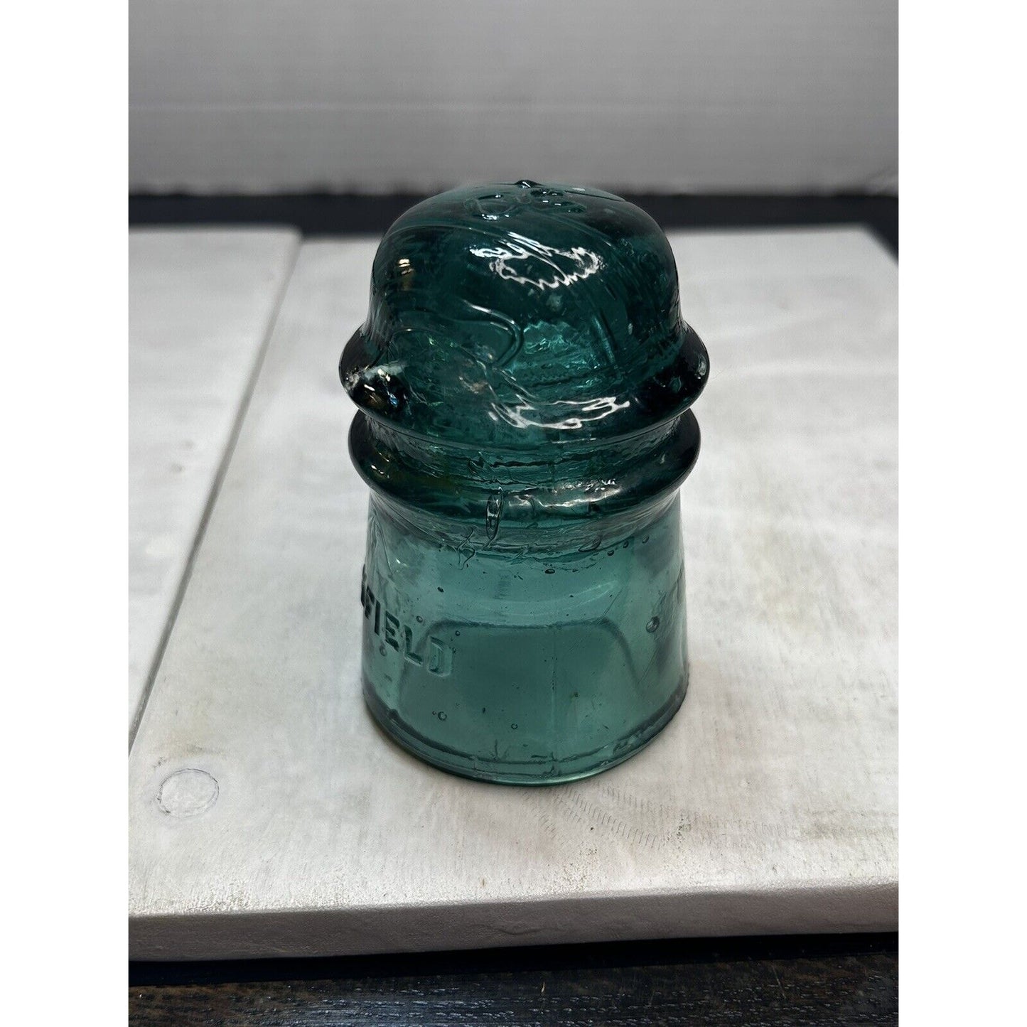 Vintage Brookfield green glass insulator top embossed crown