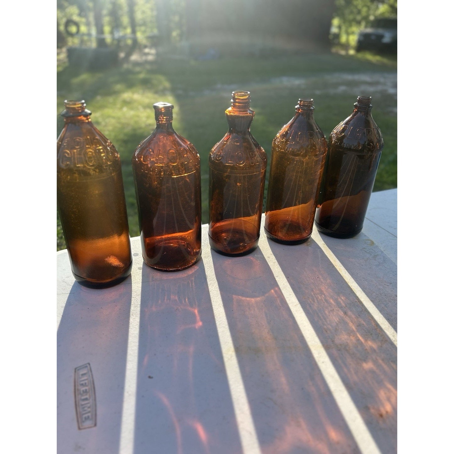Vintage Clorox Glass Bottle Collection — Five Bottles — 1932–1955 — Amber & Brown