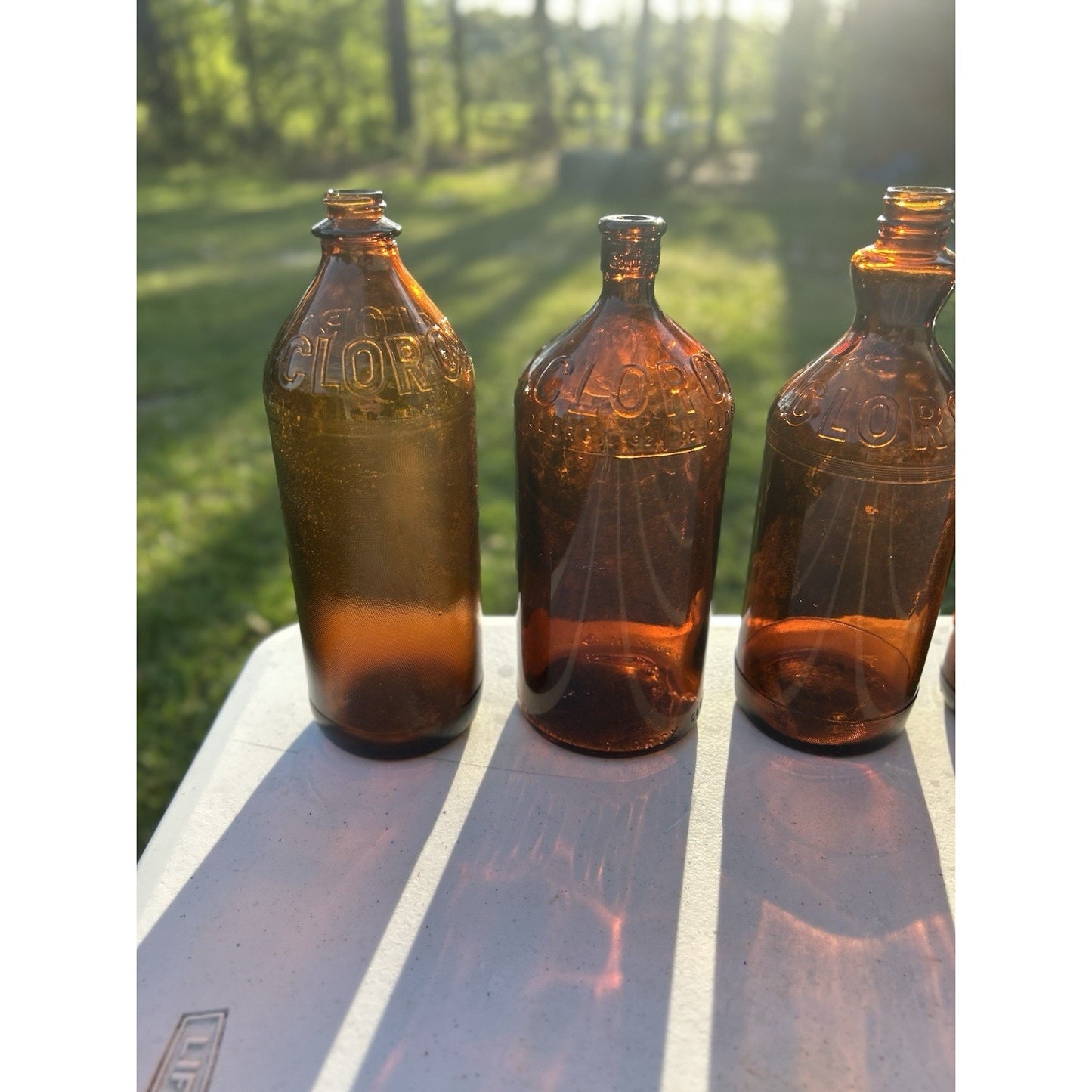 Vintage Clorox Glass Bottle Collection — Five Bottles — 1932–1955 — Amber & Brown