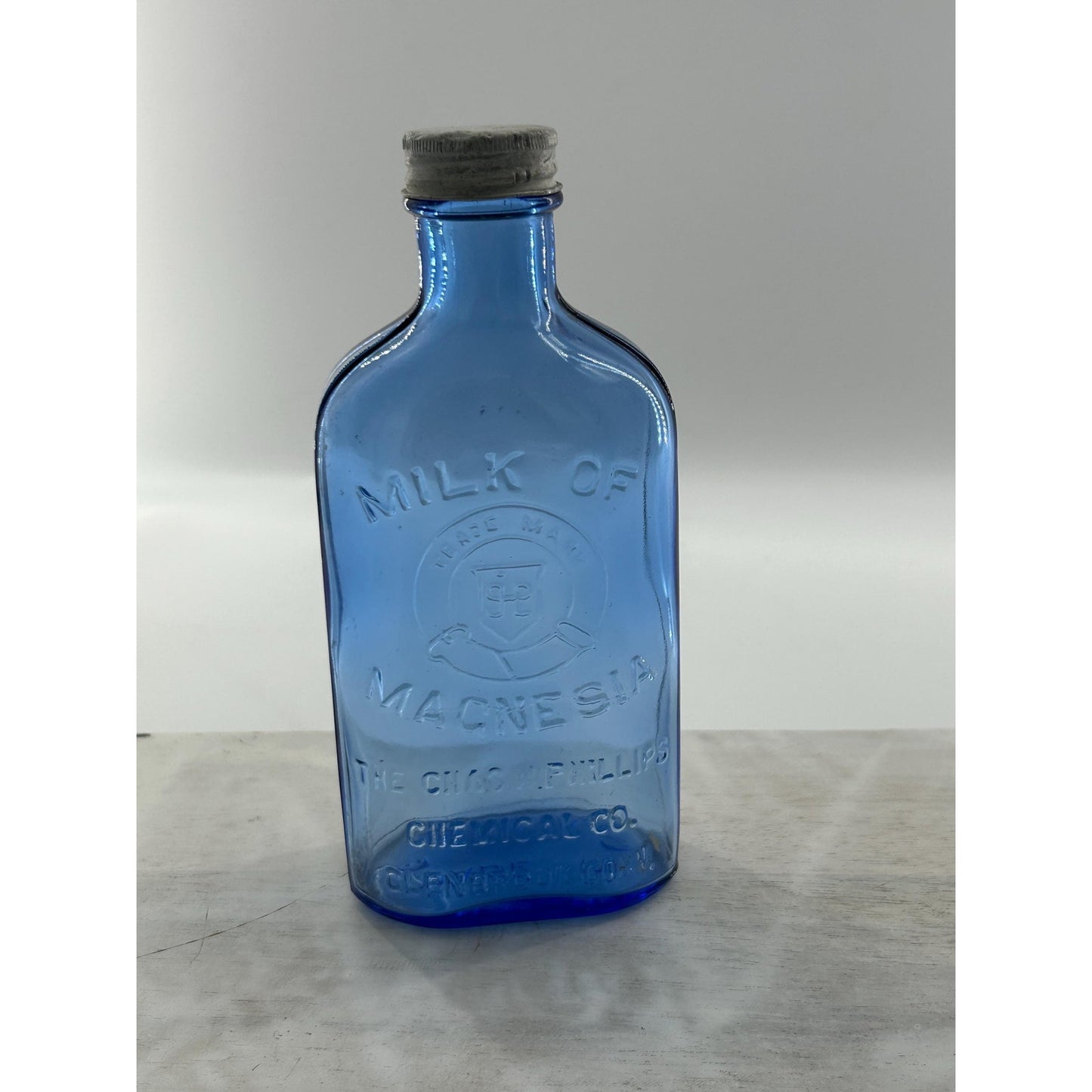 Antique Apothecary Milk of Magnesia Bottle c. 1910–1925 | Blue Glass Chas H Phillips Chemical Co. Cobalt blue apothecary bottle decor