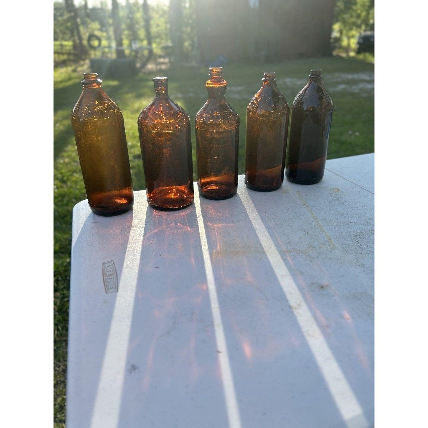 Vintage Clorox Glass Bottle Collection — Five Bottles — 1932–1955 — Amber & Brown