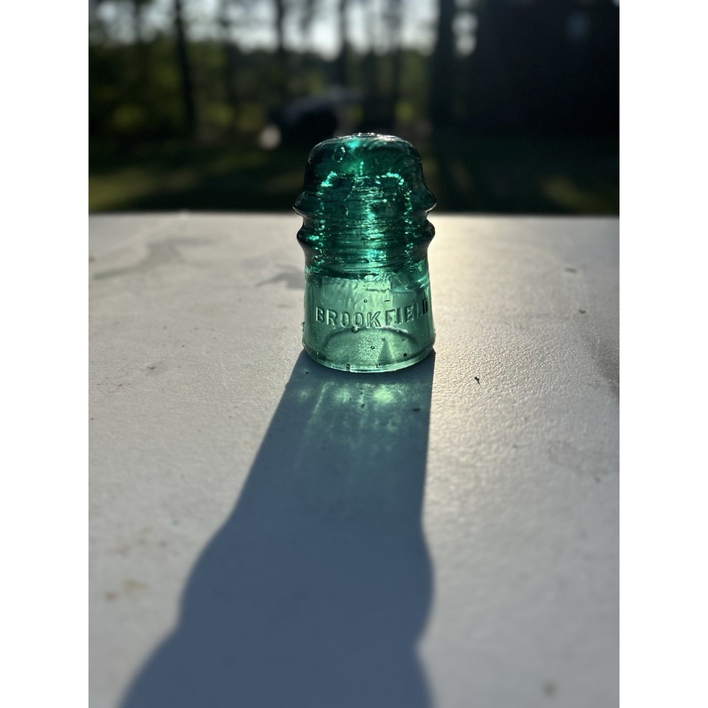 Emerald Brookfield glass insulator back view drip points