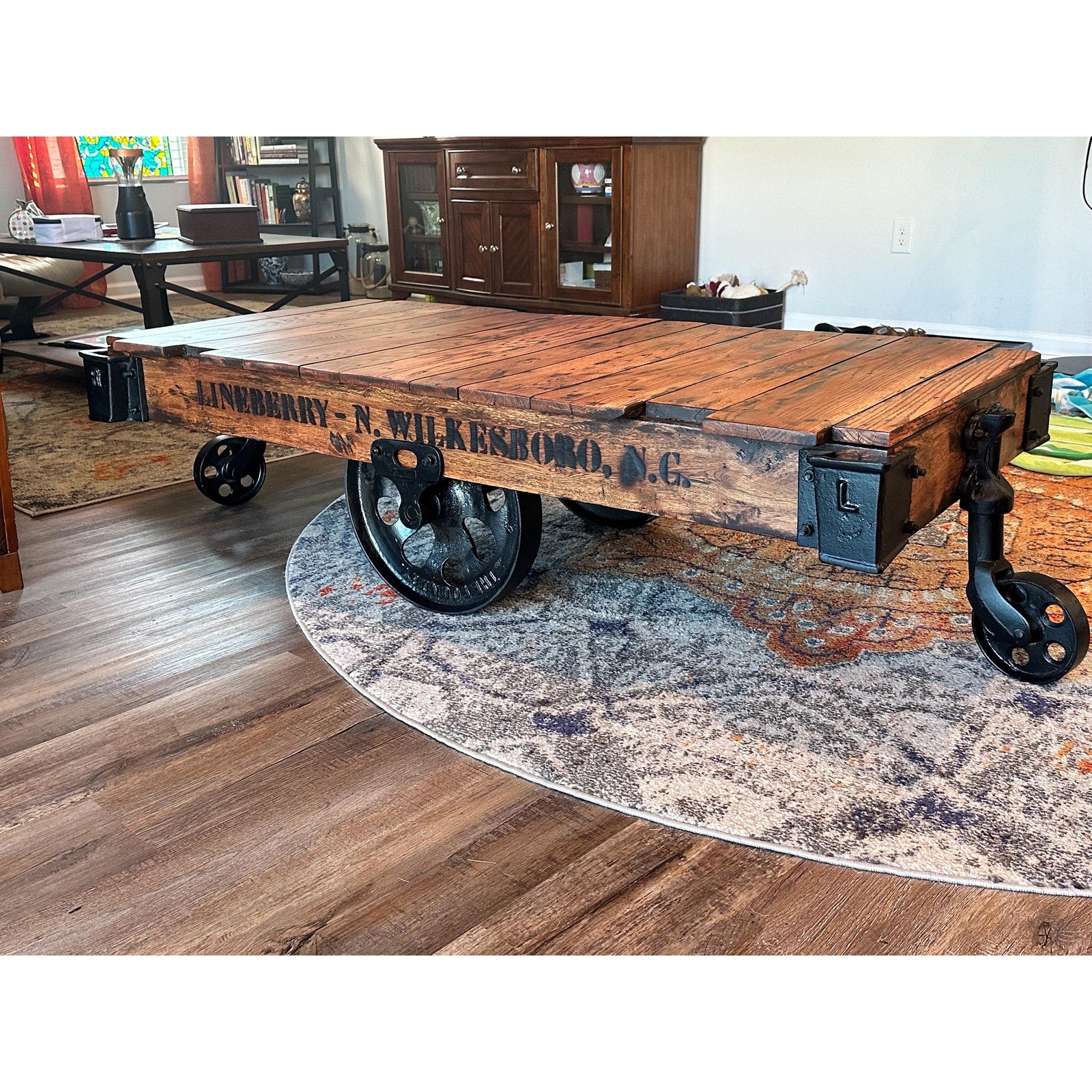 Antique Lineberry mill cart full profile — restored solid wood deck, Daisy Wheel cast iron casters