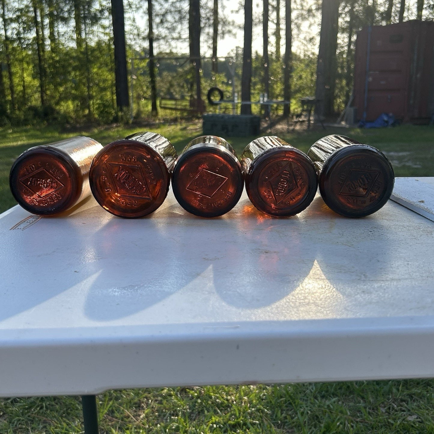 Vintage Clorox Glass Bottle Collection — Five Bottles — 1932–1955 — Amber & Brown
