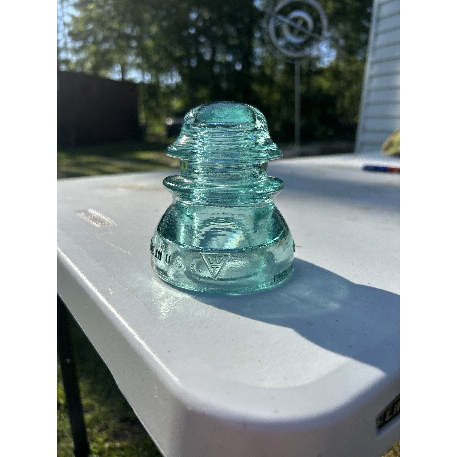 Antique Whitall Tatum Co No 1 ice blue glass insulator side profile view