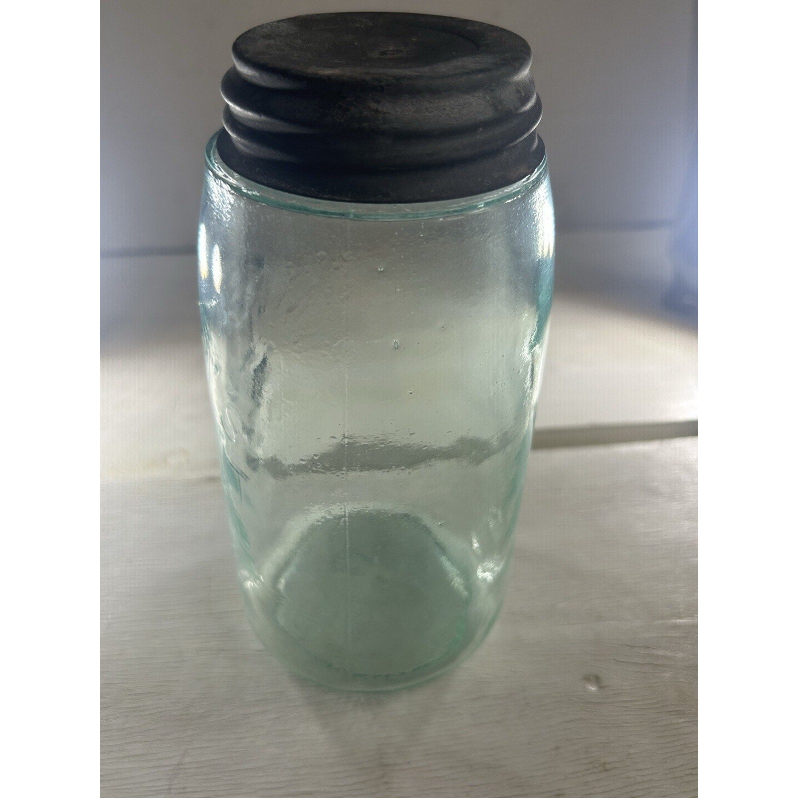 Antique Mason 1858 jar top view — zinc lid seated correctly on aqua quart jar