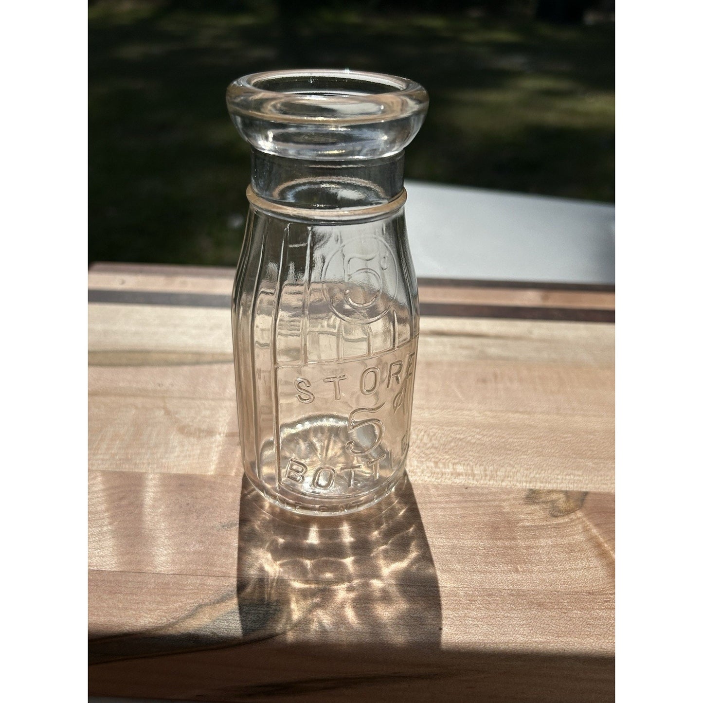 Vintage Universal Store milk bottle color natural light display