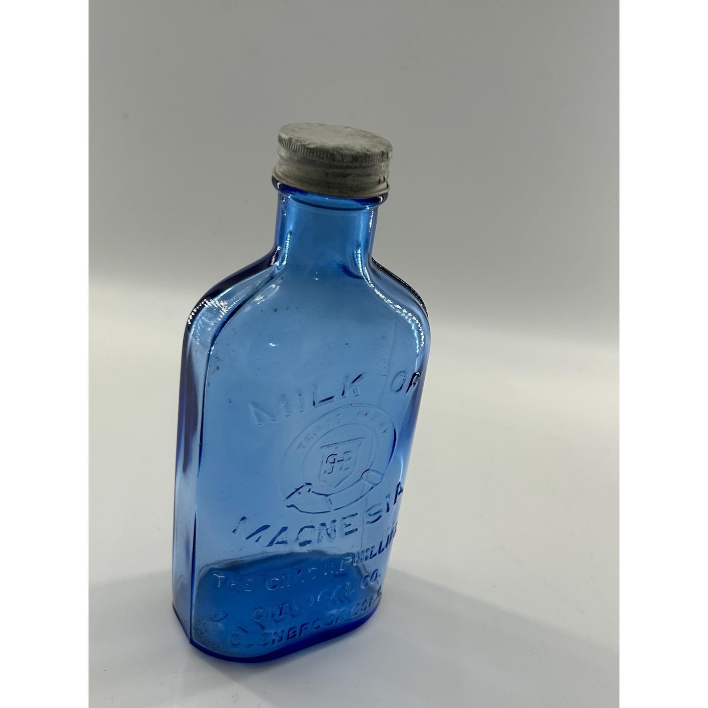 Antique Apothecary Milk of Magnesia Bottle c. 1910–1925 | Blue Glass Chas H Phillips Chemical Co. Cobalt blue apothecary bottle decor