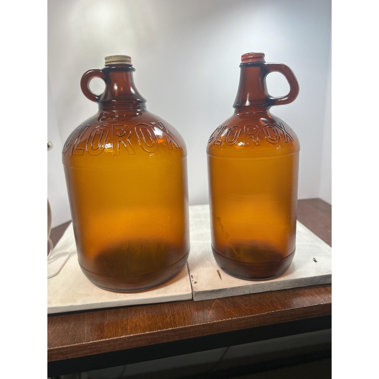 Lot of 2 Vintage Clorox Brown Glass Jugs – 1 Gallon & Half Gallon, Embossed Amber Bottles w/ Original Caps, 1940s–1950s Bleach Bottles