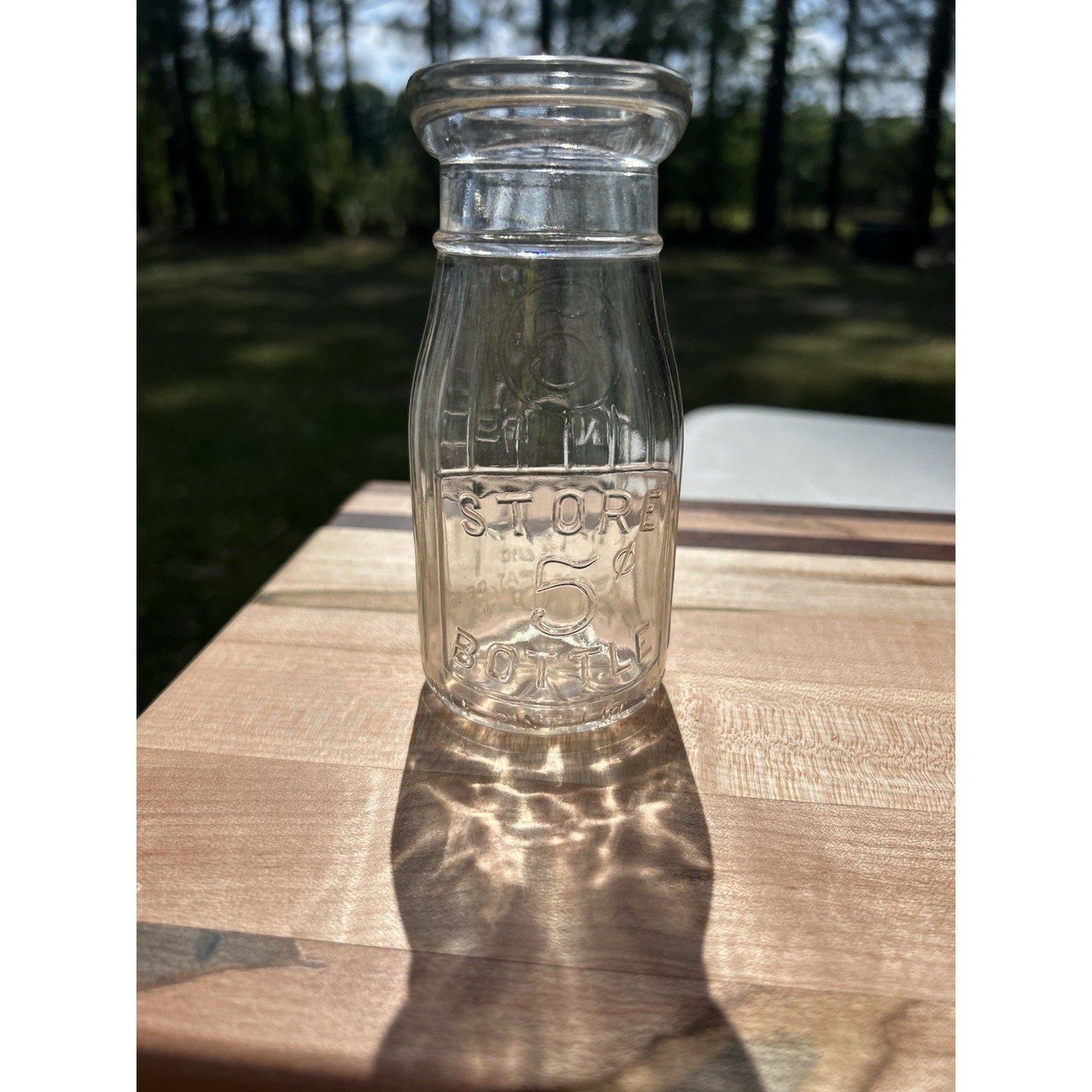 Vintage half pint milk bottle Universal Store top view