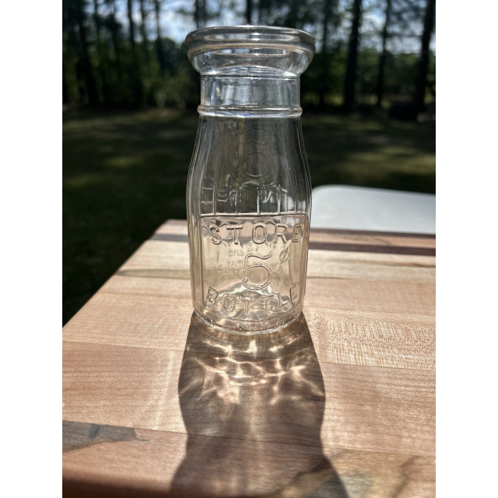 Vintage half pint milk bottle Universal Store top view
