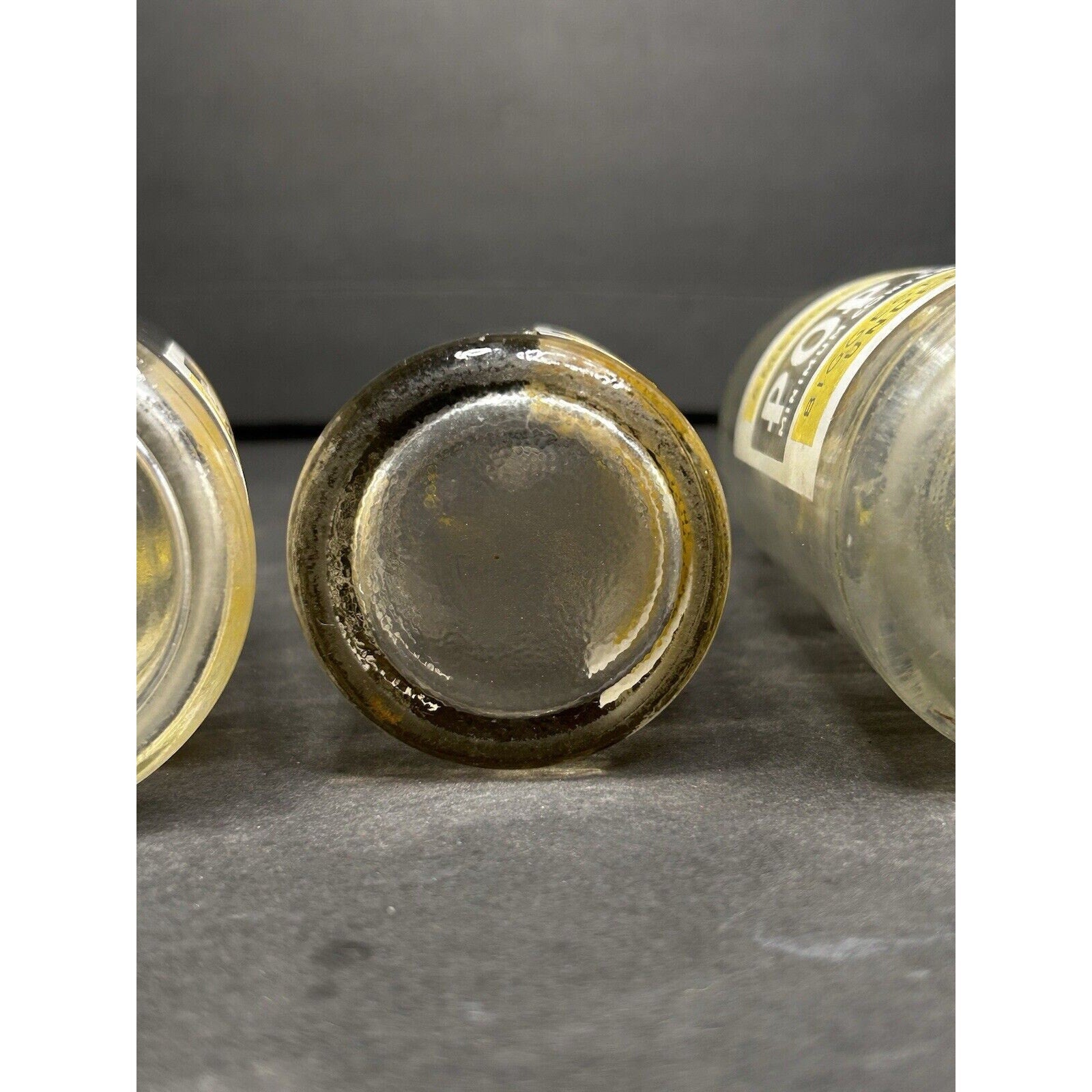 Antique Pop Kola Junior soda bottles all angles — cola advertising glass set, early 20th century embossed