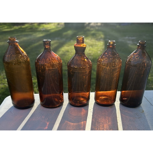 Vintage Clorox Glass Bottle Collection — Five Bottles — 1932–1955 — Amber & Brown