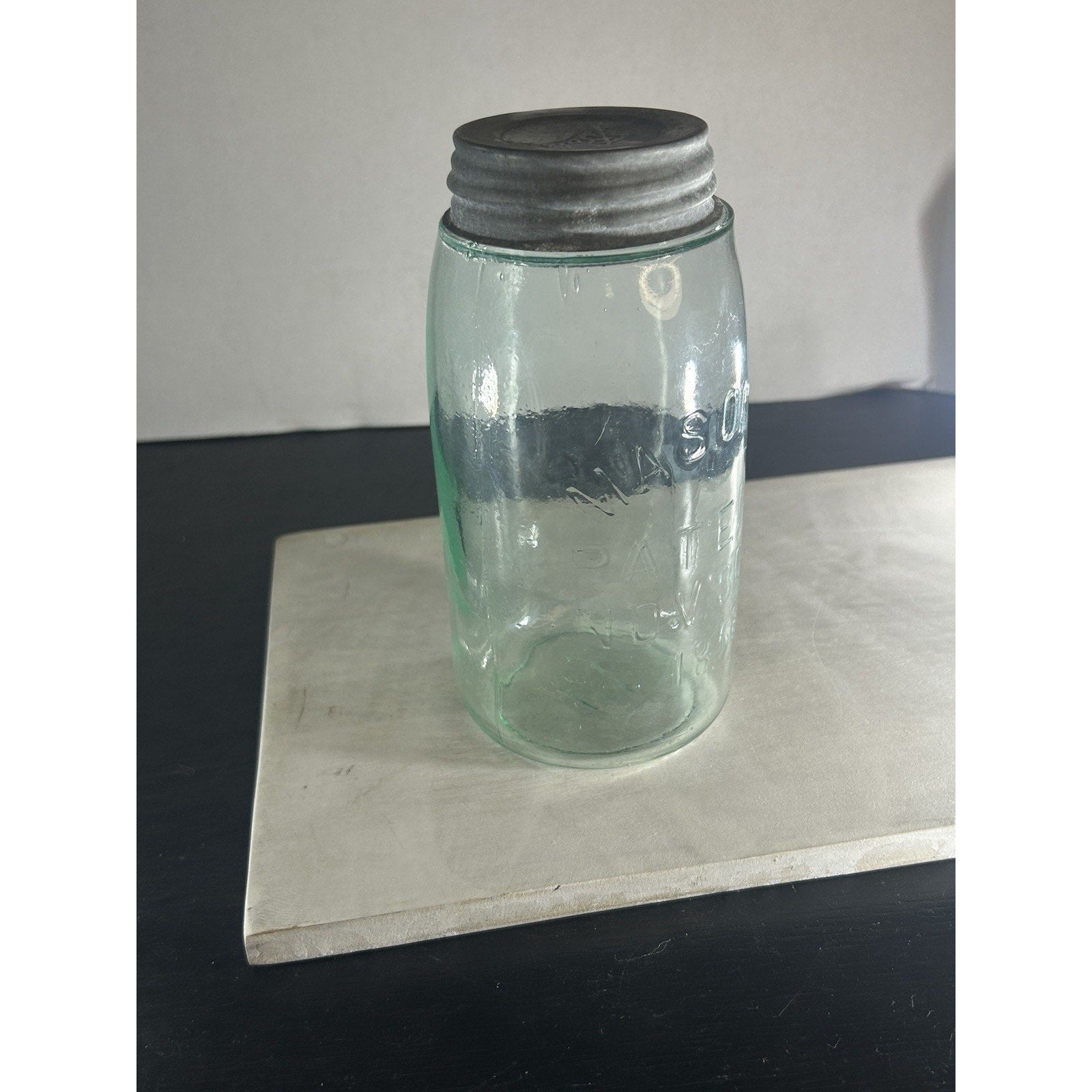 Antique Mason 1858 quart jar color light through blue glass
