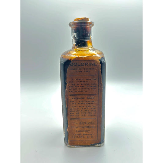 Dolorine medicine bottle full contents cork stopper side