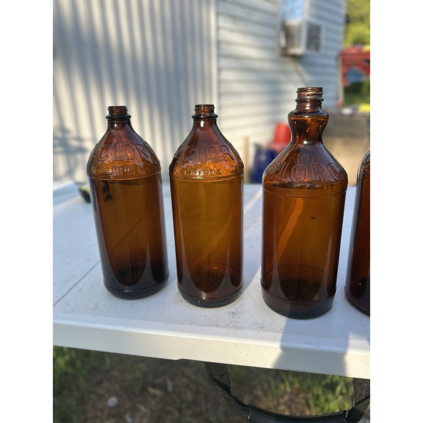Vintage Clorox Glass Bottle Collection — Five Bottles — 1932–1955 — Amber & Brown