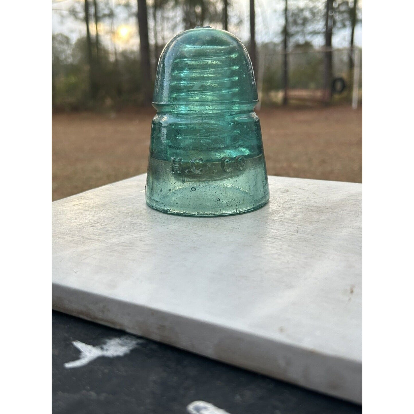 Antique H.G. Co beehive insulator aqua base mark detail
