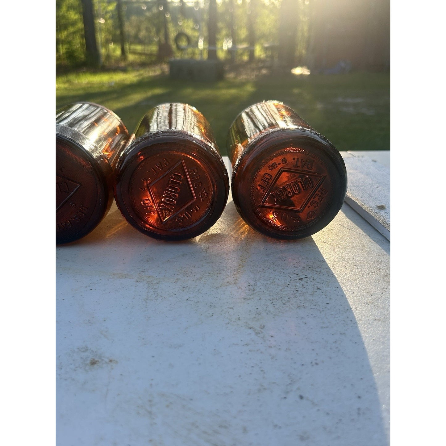 Vintage Clorox Glass Bottle Collection — Five Bottles — 1932–1955 — Amber & Brown