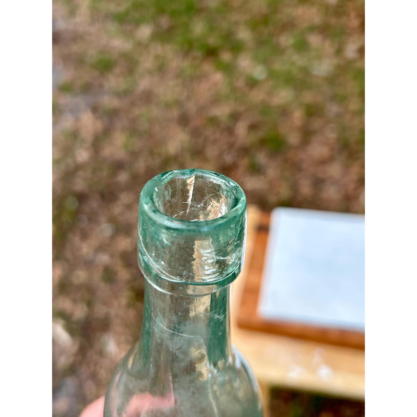 Antique aqua glass bottle base showing deep push-up and mold number 226