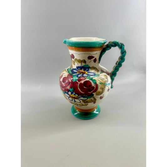 Vintage Spanish Talavera style faience pitcher with sculptural twisted rope handle, hand-painted floral decoration