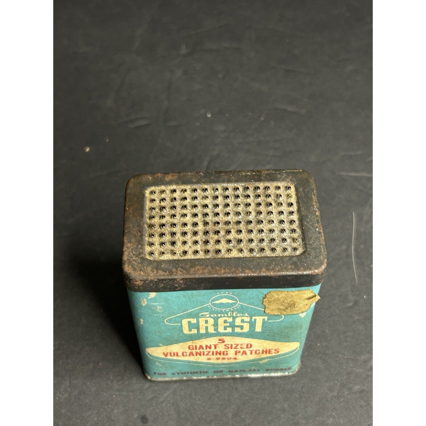 Vintage Crest tire patch tin base advertising detail