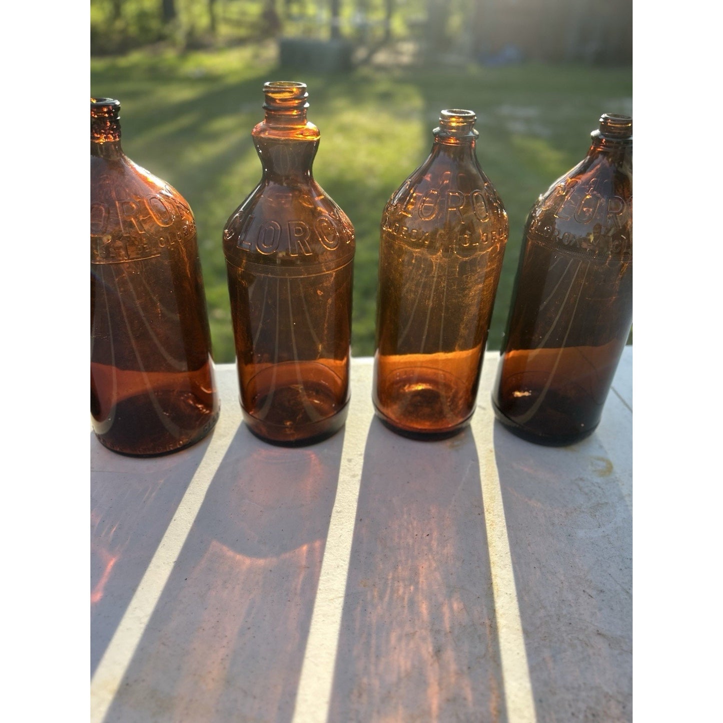 Vintage Clorox Glass Bottle Collection — Five Bottles — 1932–1955 — Amber & Brown