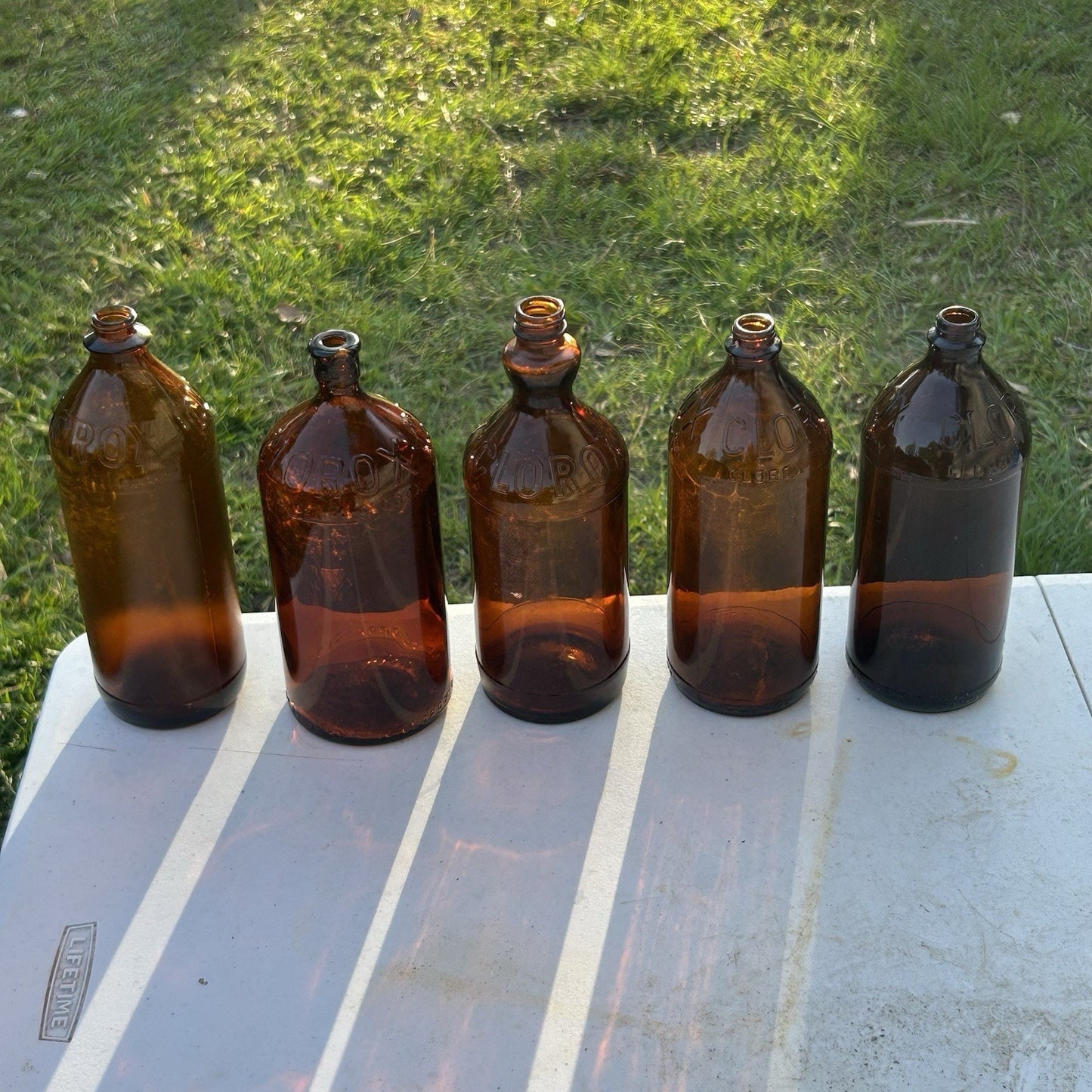 Vintage Clorox Glass Bottle Collection — Five Bottles — 1932–1955 — Amber & Brown