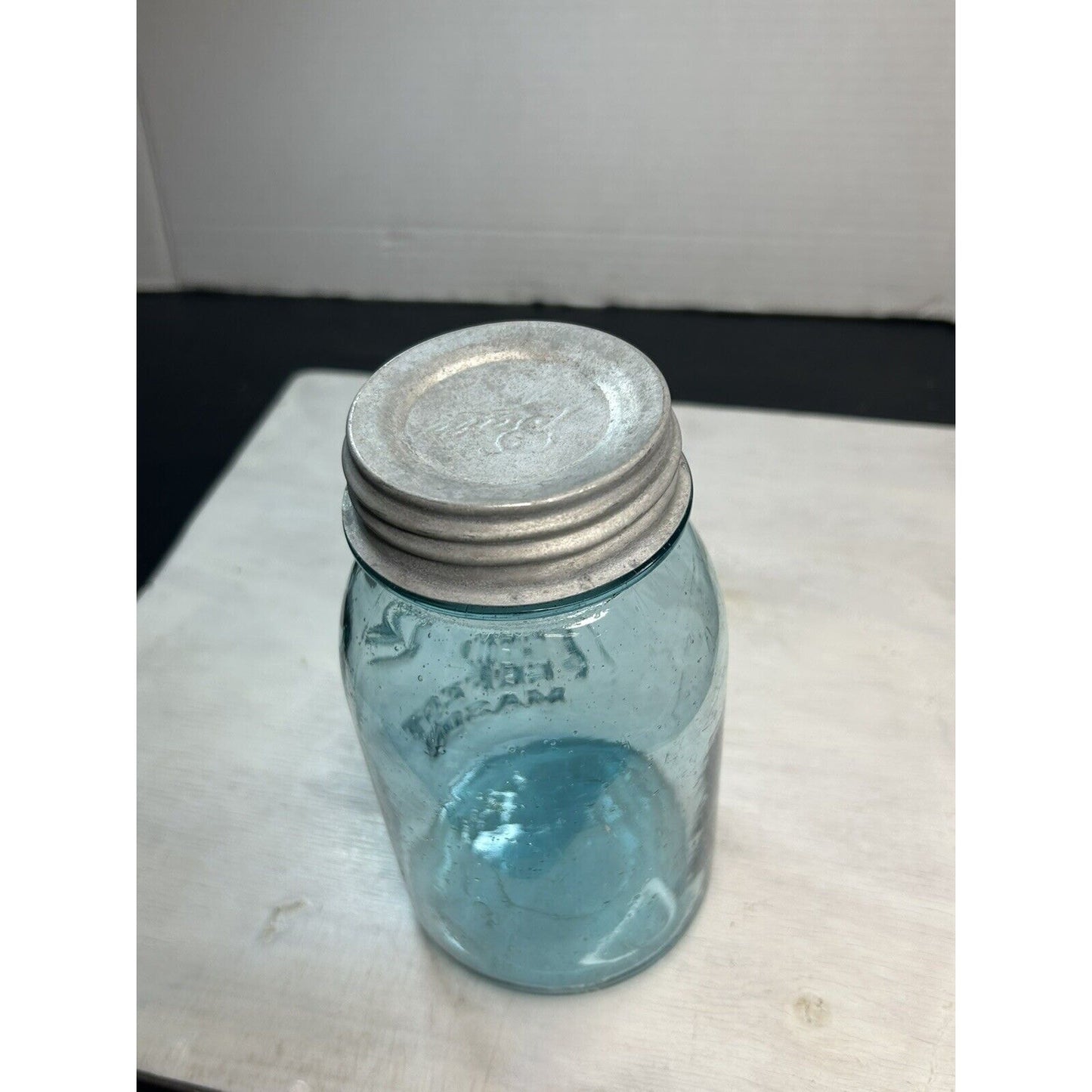 Antique Ball Perfect Mason quart jar — natural light view showing aqua blue glass color and embossing depth