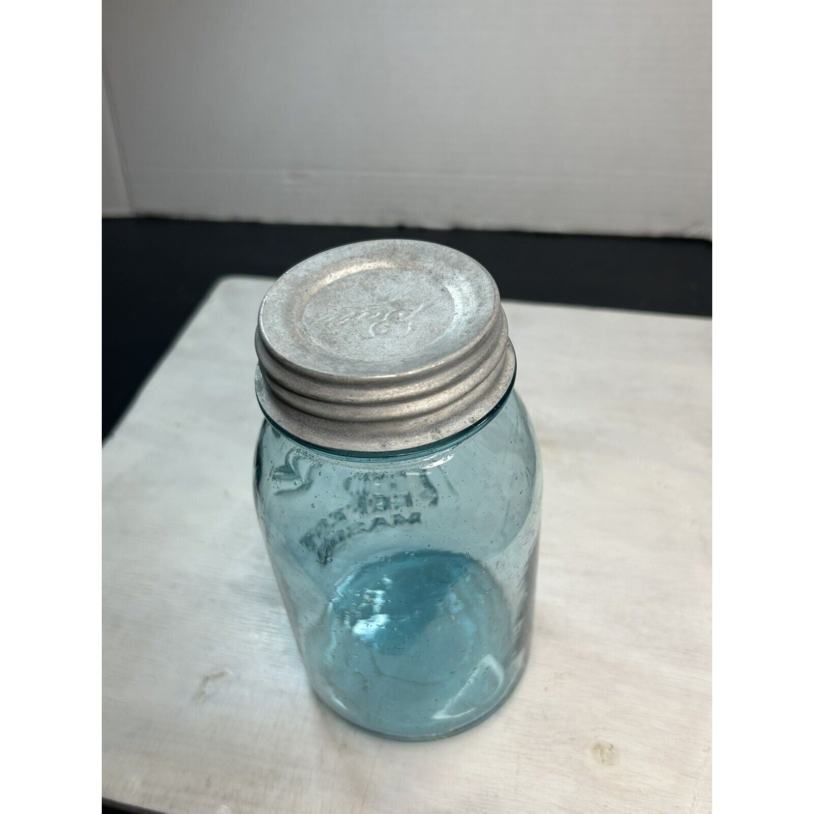 Antique Ball Perfect Mason quart jar — natural light view showing aqua blue glass color and embossing depth