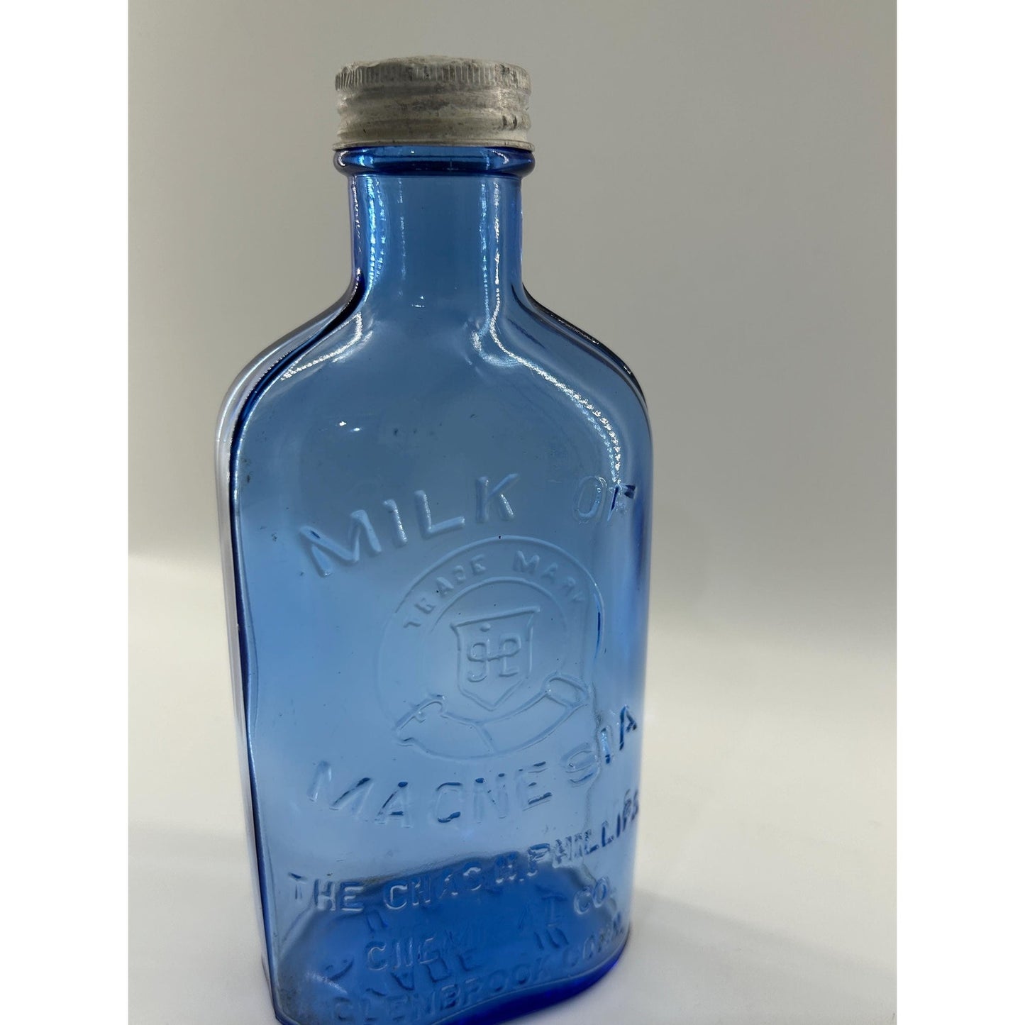 Antique Apothecary Milk of Magnesia Bottle c. 1910–1925 | Blue Glass Chas H Phillips Chemical Co. Cobalt blue apothecary bottle decor
