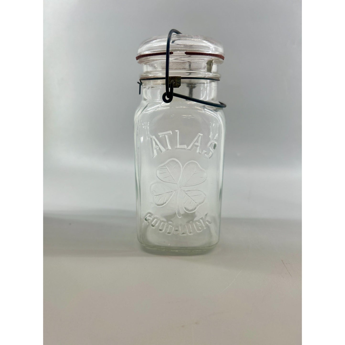 Atlas Good Luck Clover Quart Mason Jar Original Wire Bail Glass Lid Antique Hazel Atlas 1920s. With original gasket . Incredible condition.