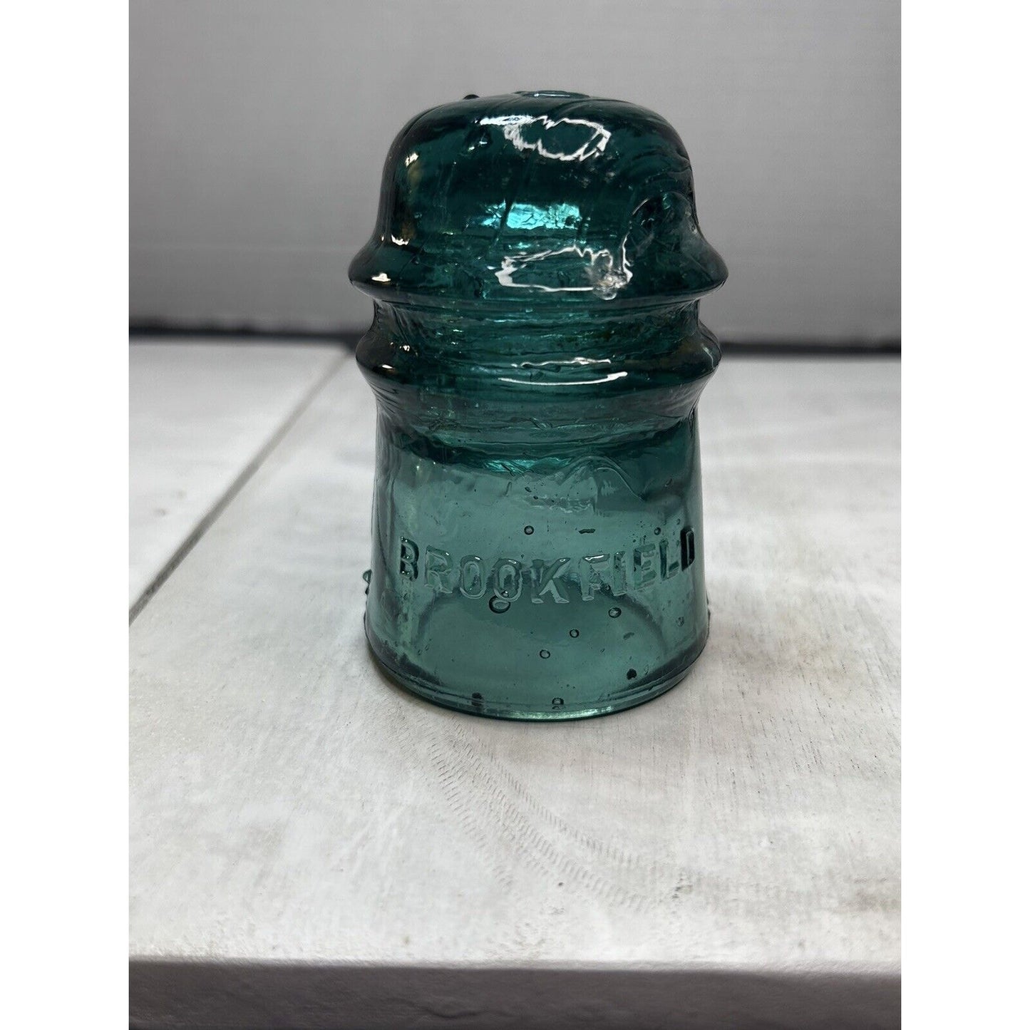 Antique GREEN Brookfield embossed top insulator side view