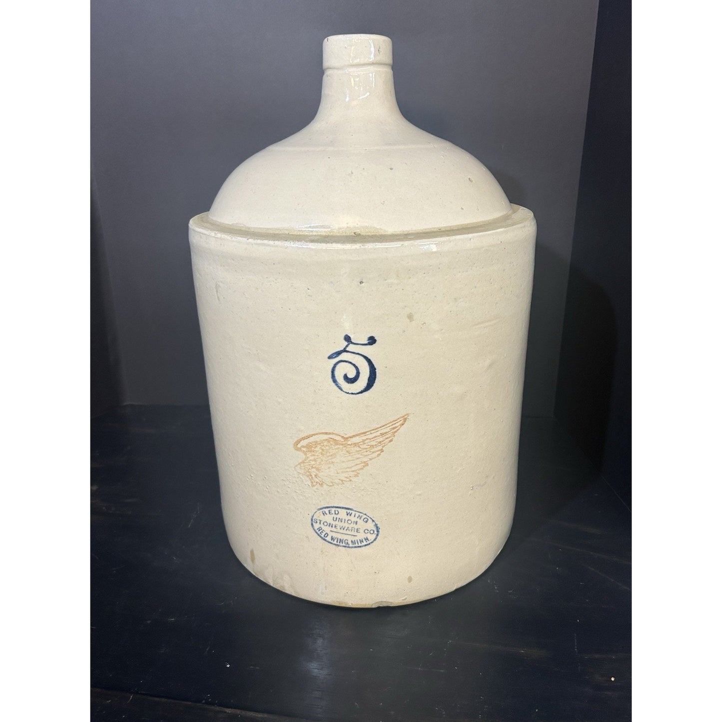 Red Wing 5 gallon crock shoulder jug 4 inch wing logo detail