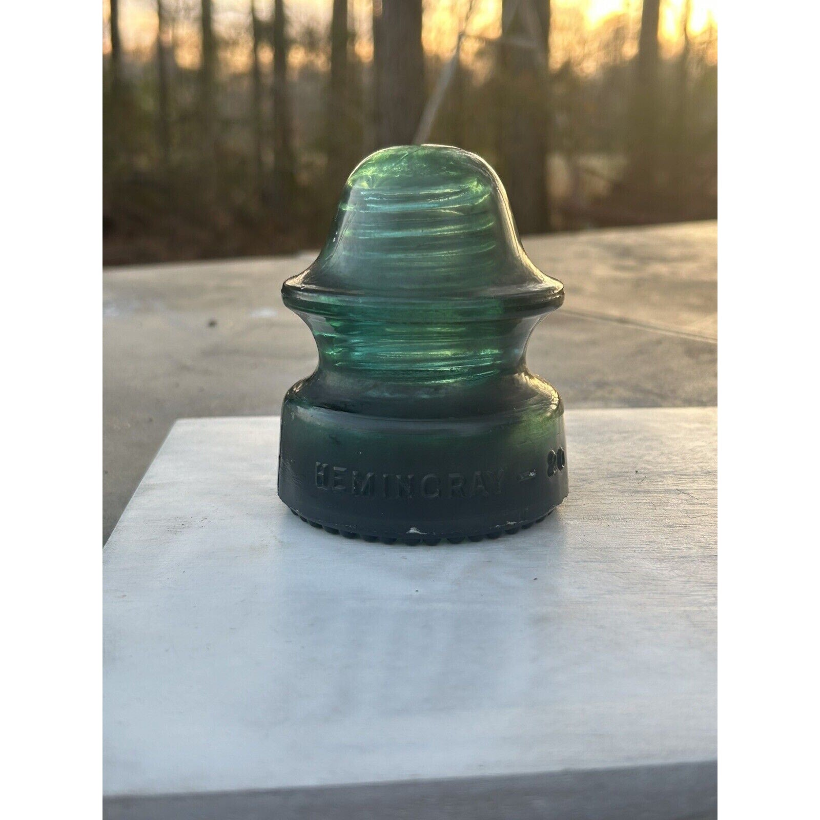 Hemingray No 20 dark green emerald glass insulator side view