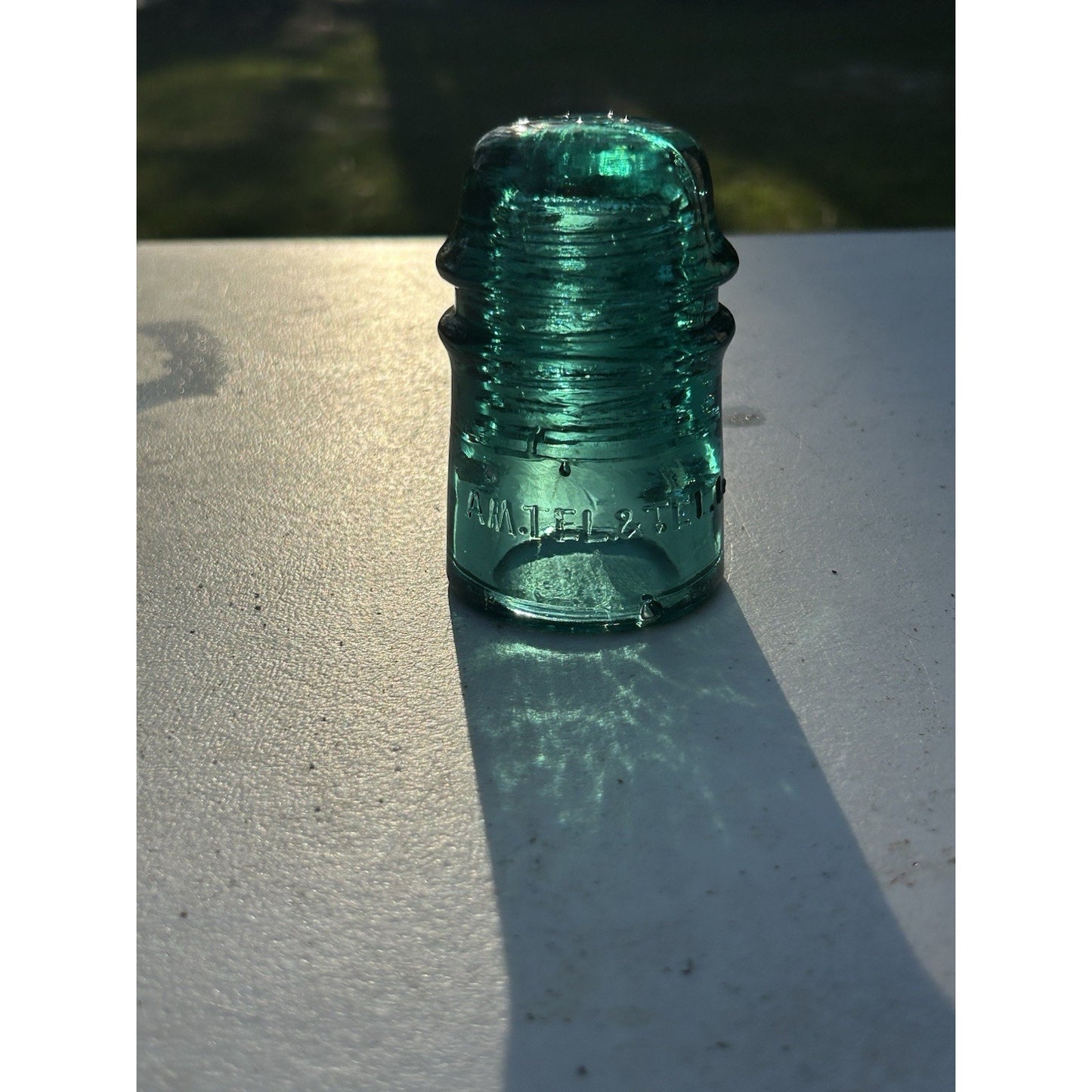 Ice green telephone insulator AM TEL CO crown top mark