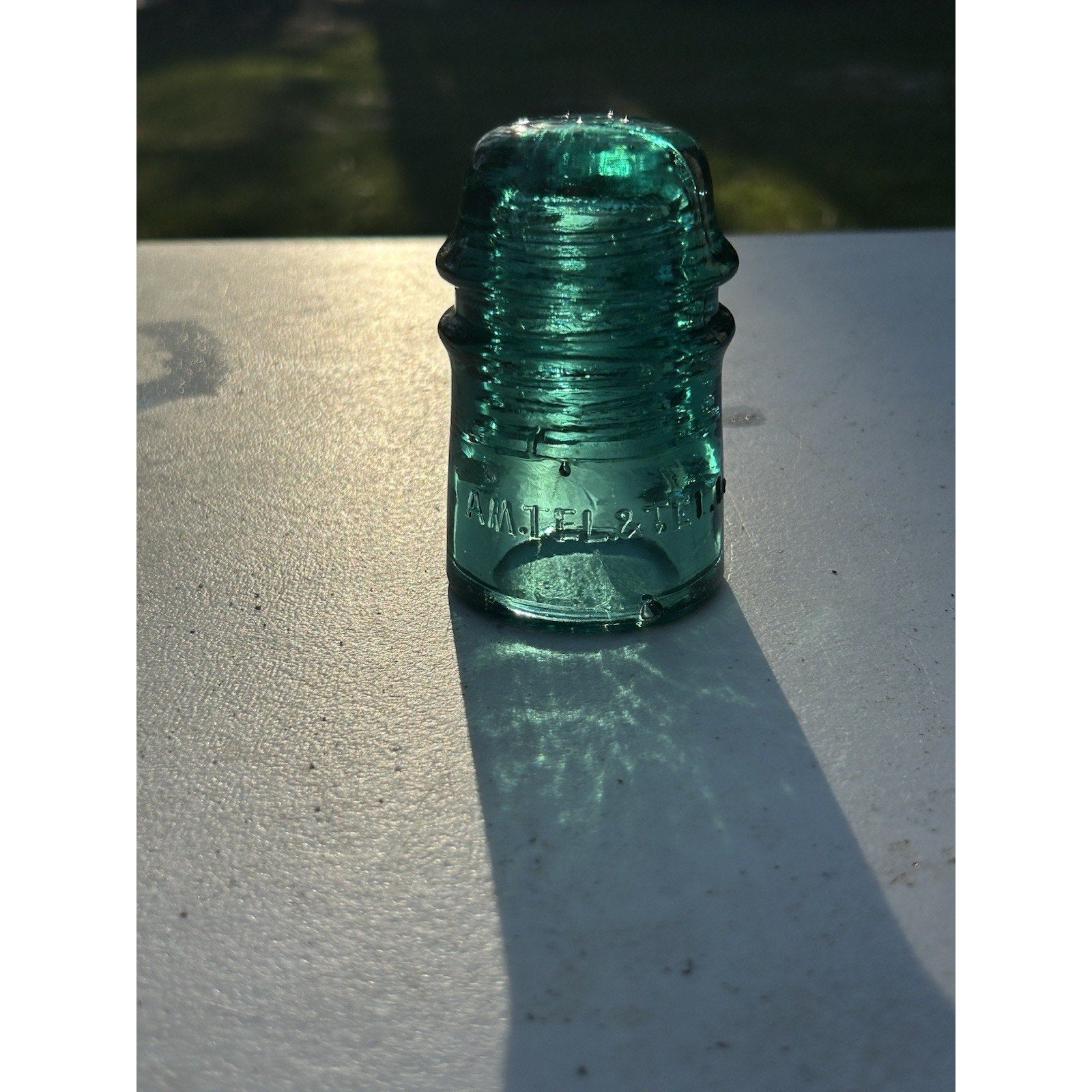 Ice green telephone insulator AM TEL CO crown top mark