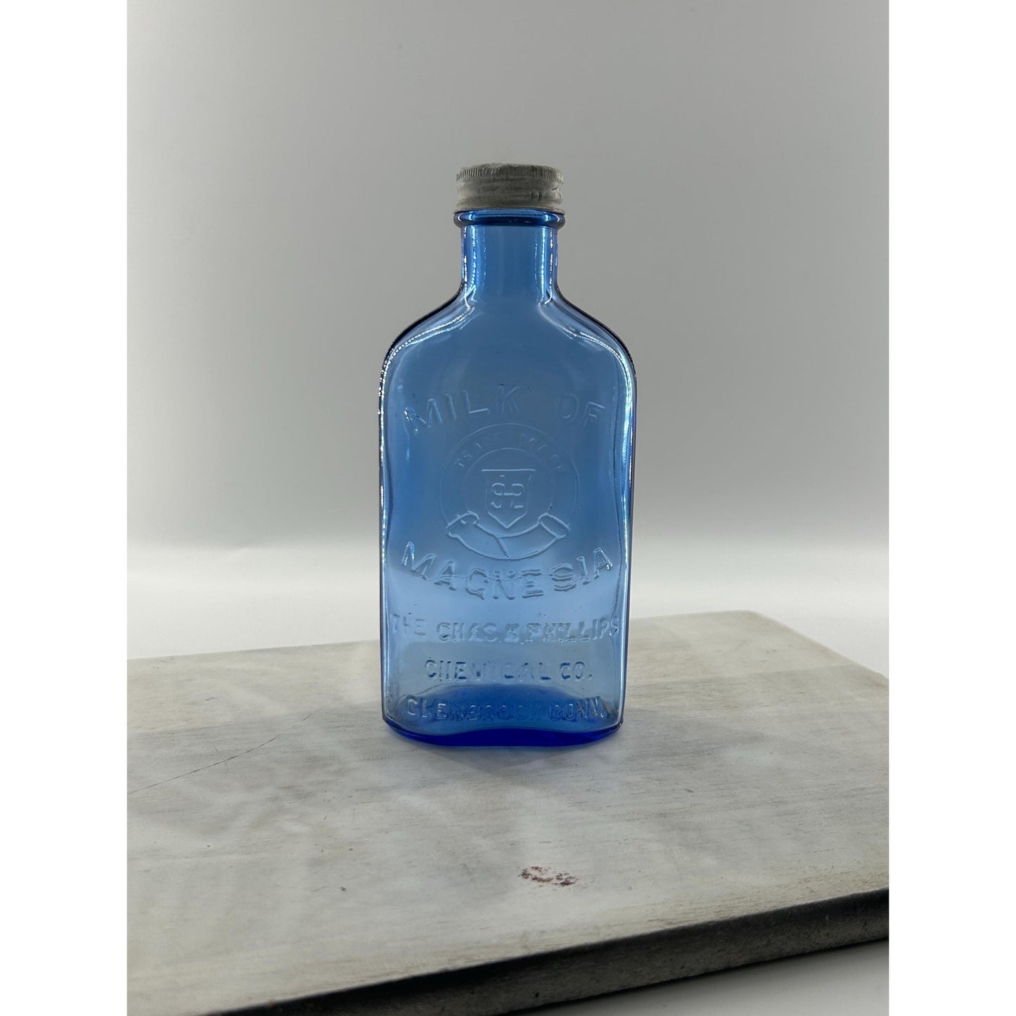 Antique Apothecary Milk of Magnesia Bottle c. 1910–1925 | Blue Glass Chas H Phillips Chemical Co. Cobalt blue apothecary bottle decor