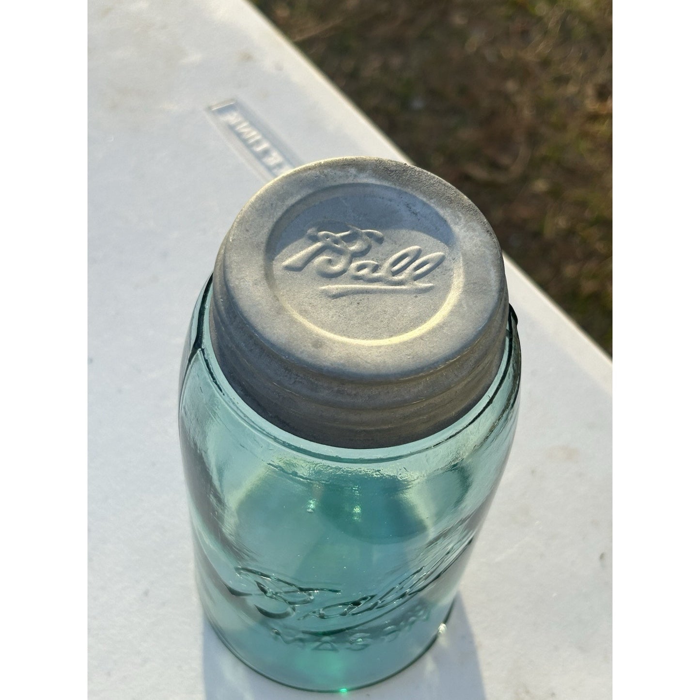 Ball Triple L blue mason jar light through aqua glass
