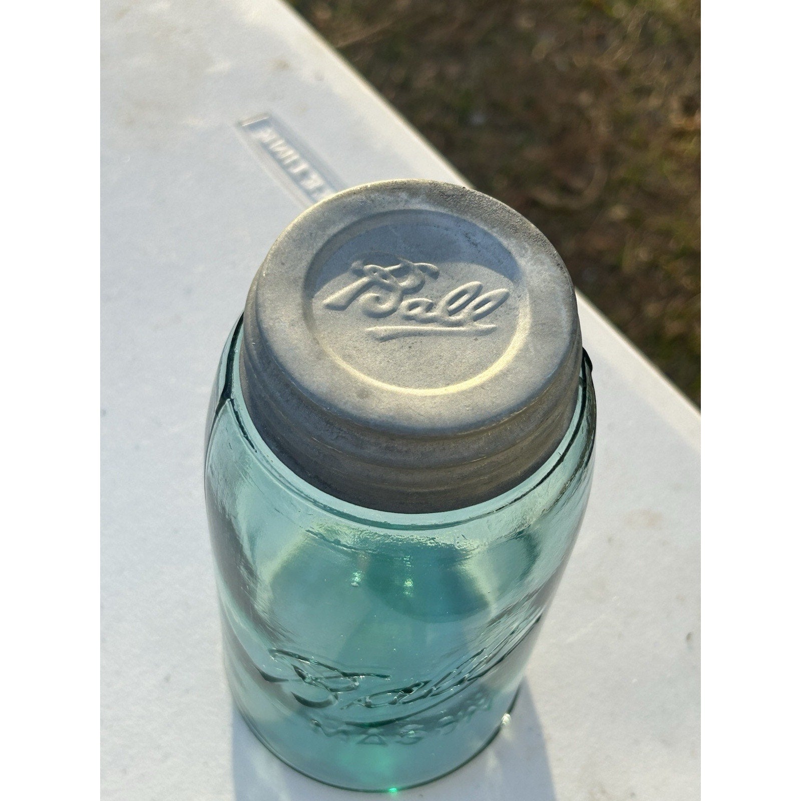 Ball Triple L blue mason jar light through aqua glass