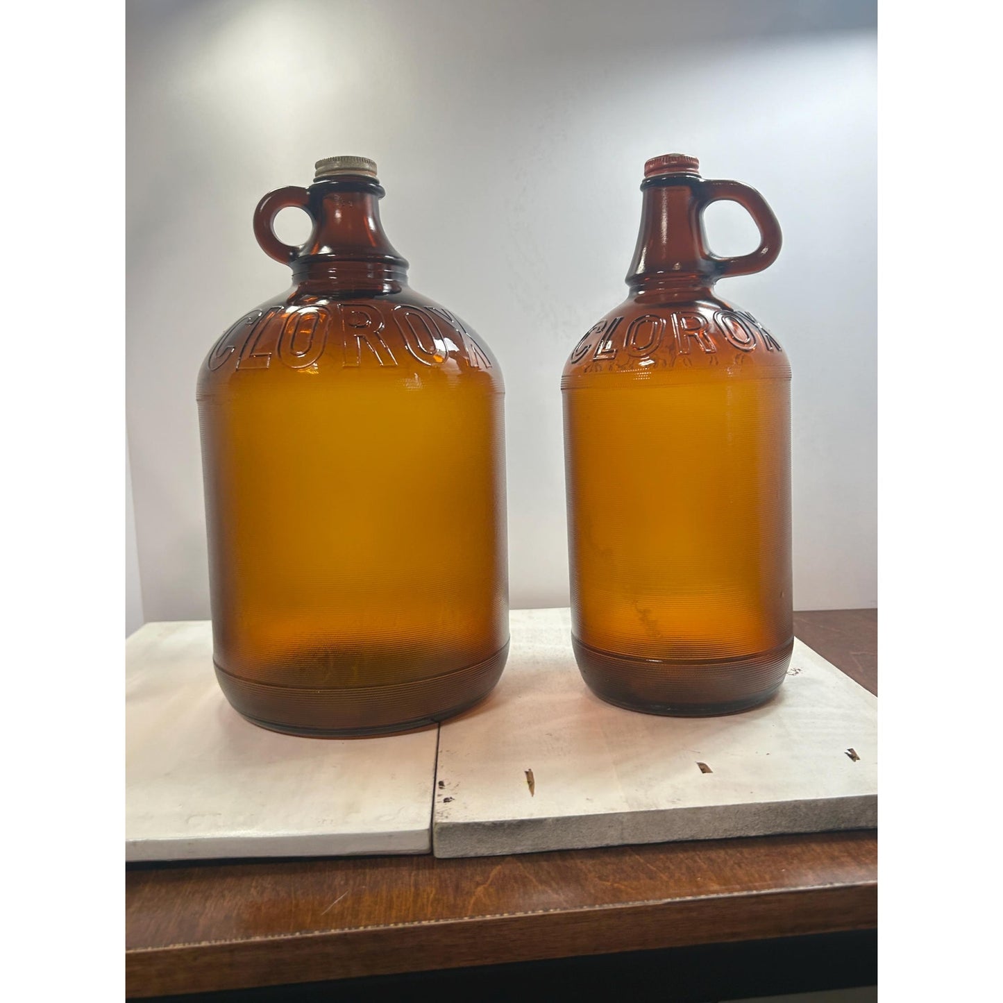 Lot of 2 Vintage Clorox Brown Glass Jugs – 1 Gallon & Half Gallon, Embossed Amber Bottles w/ Original Caps, 1940s–1950s Bleach Bottles
