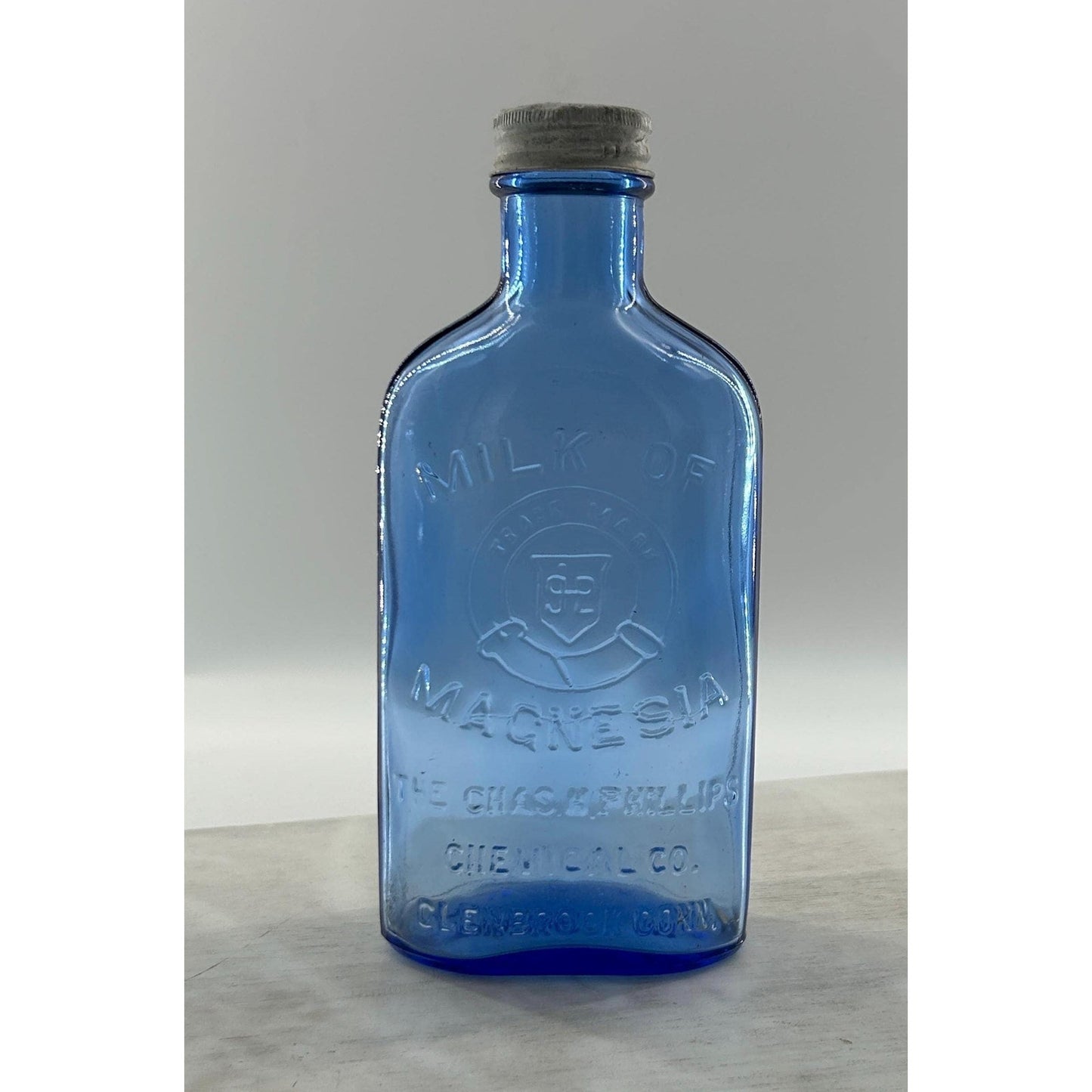 Antique Apothecary Milk of Magnesia Bottle c. 1910–1925 | Blue Glass Chas H Phillips Chemical Co. Cobalt blue apothecary bottle decor