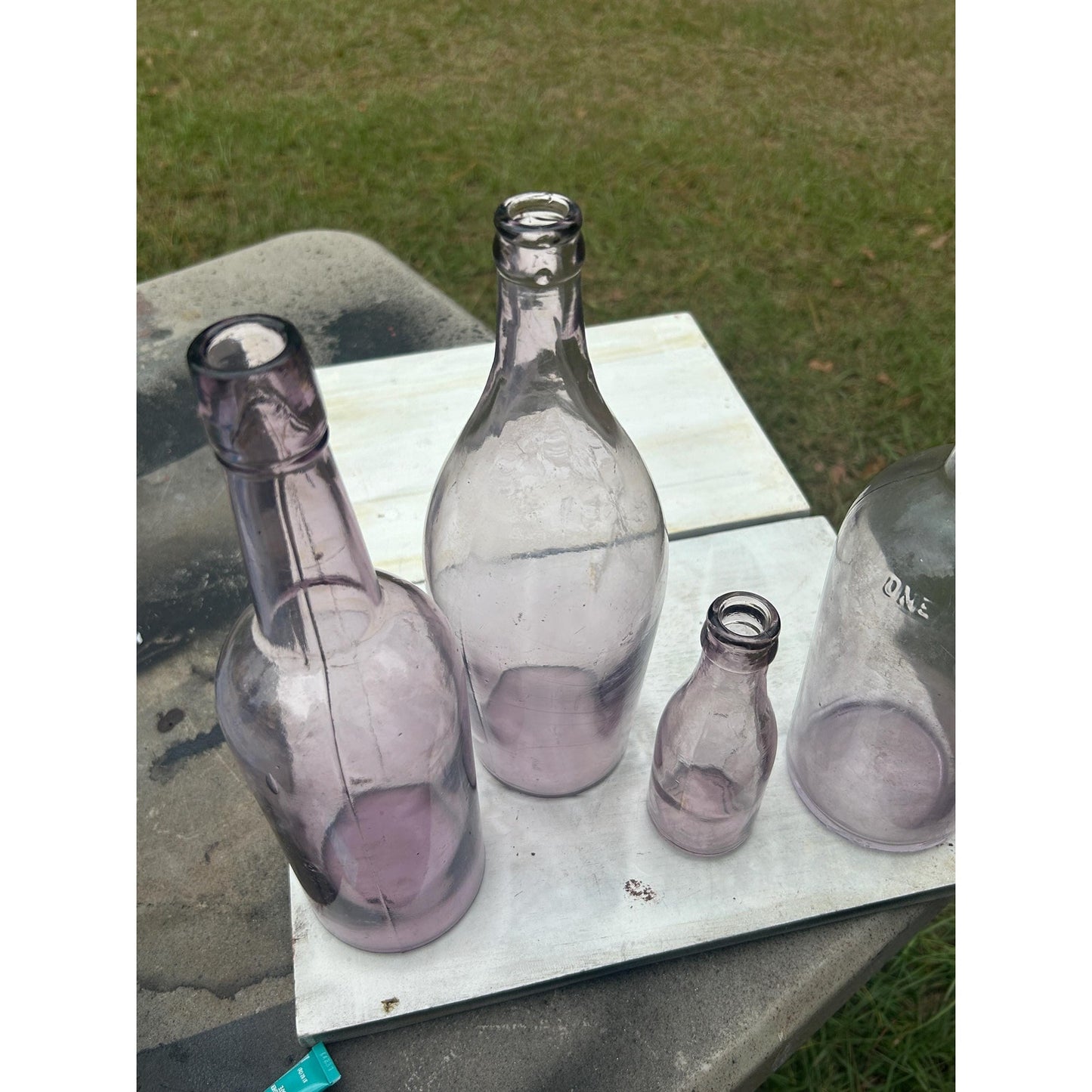 Set of 4 Antique Purple Glass Bottles Sun Co Early 1900s Hand Blown Apothecary Bottles Collectible Display