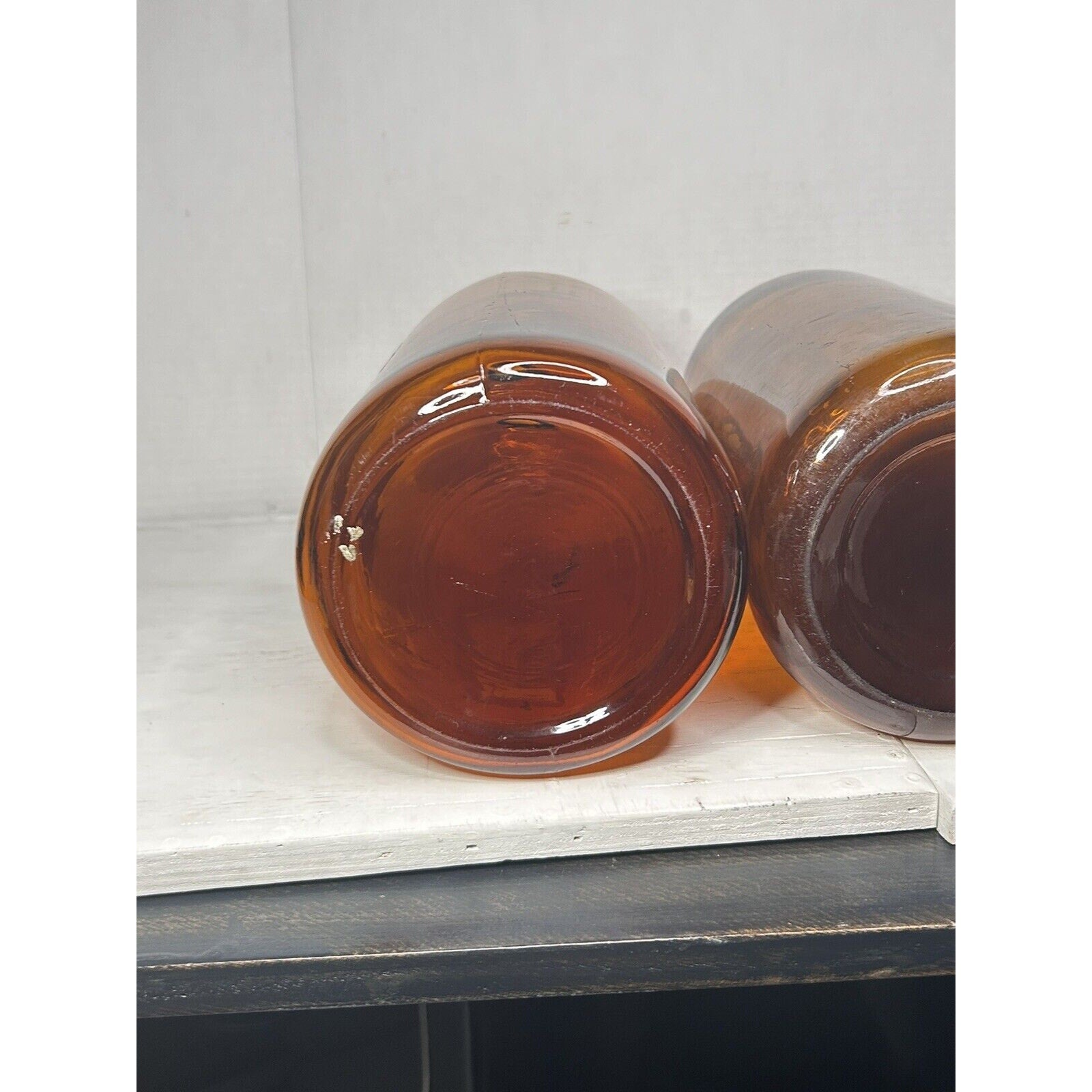 Large amber glass apothecary bottles rustic decor all angles