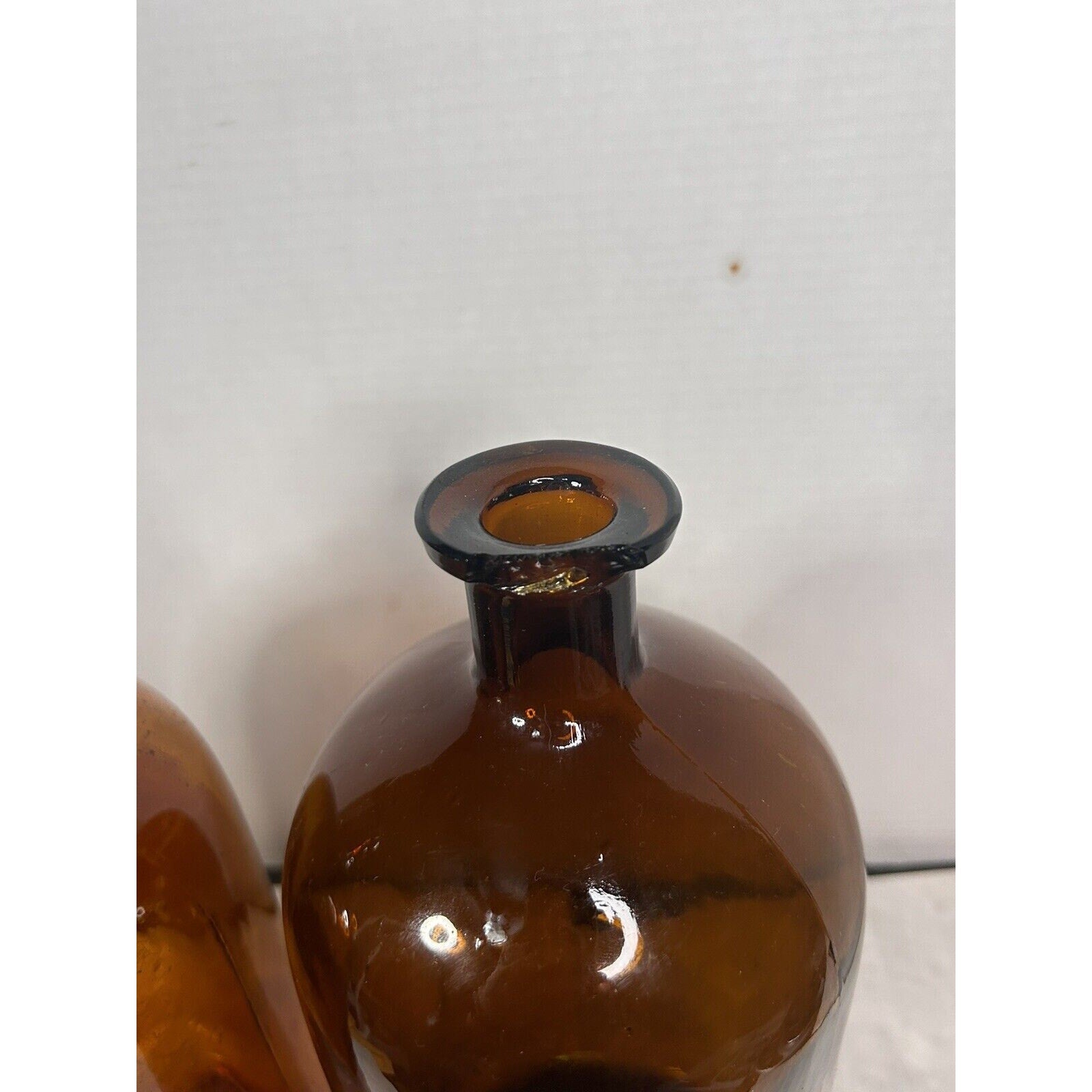Antique amber pharmacy bottle pair back view rustic decor
