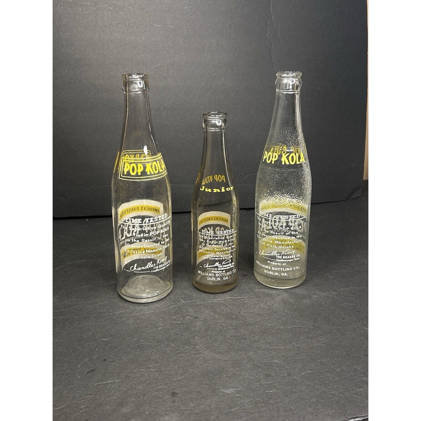 Antique Pop Kola 6oz soda bottles base marks — manufacturer embossing on early 20th century glass