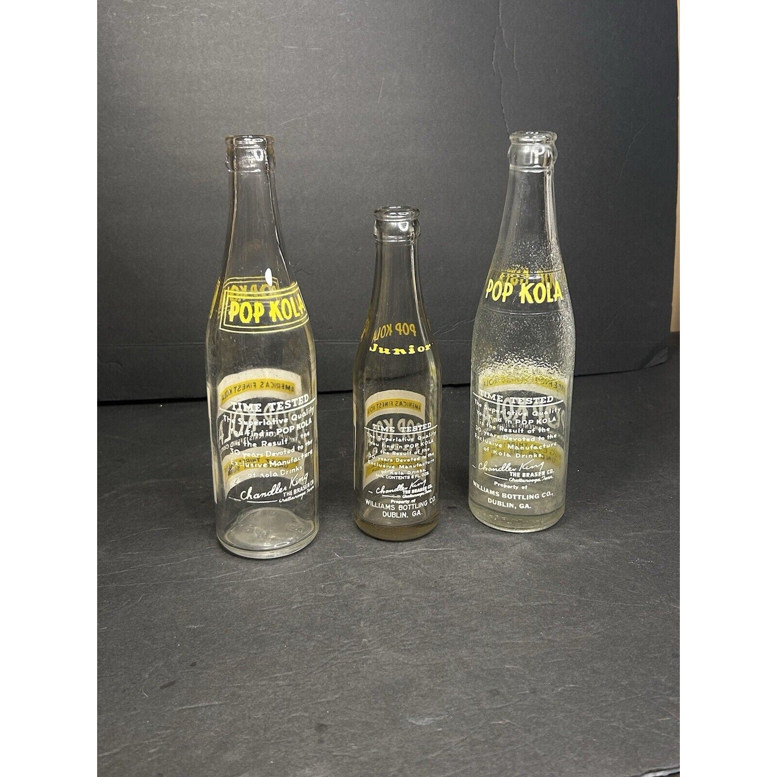 Antique Pop Kola 6oz soda bottles base marks — manufacturer embossing on early 20th century glass