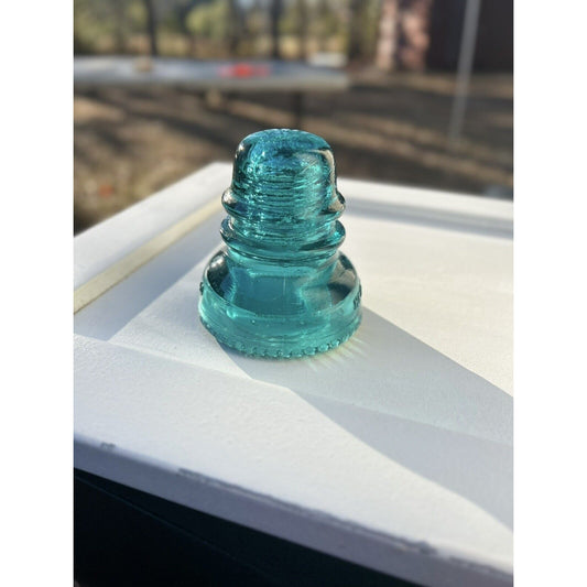 Hemingray No 40 blue glass insulator side view bubbles