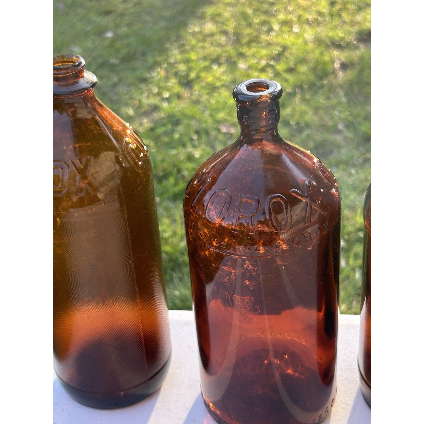 Vintage Clorox Glass Bottle Collection — Five Bottles — 1932–1955 — Amber & Brown