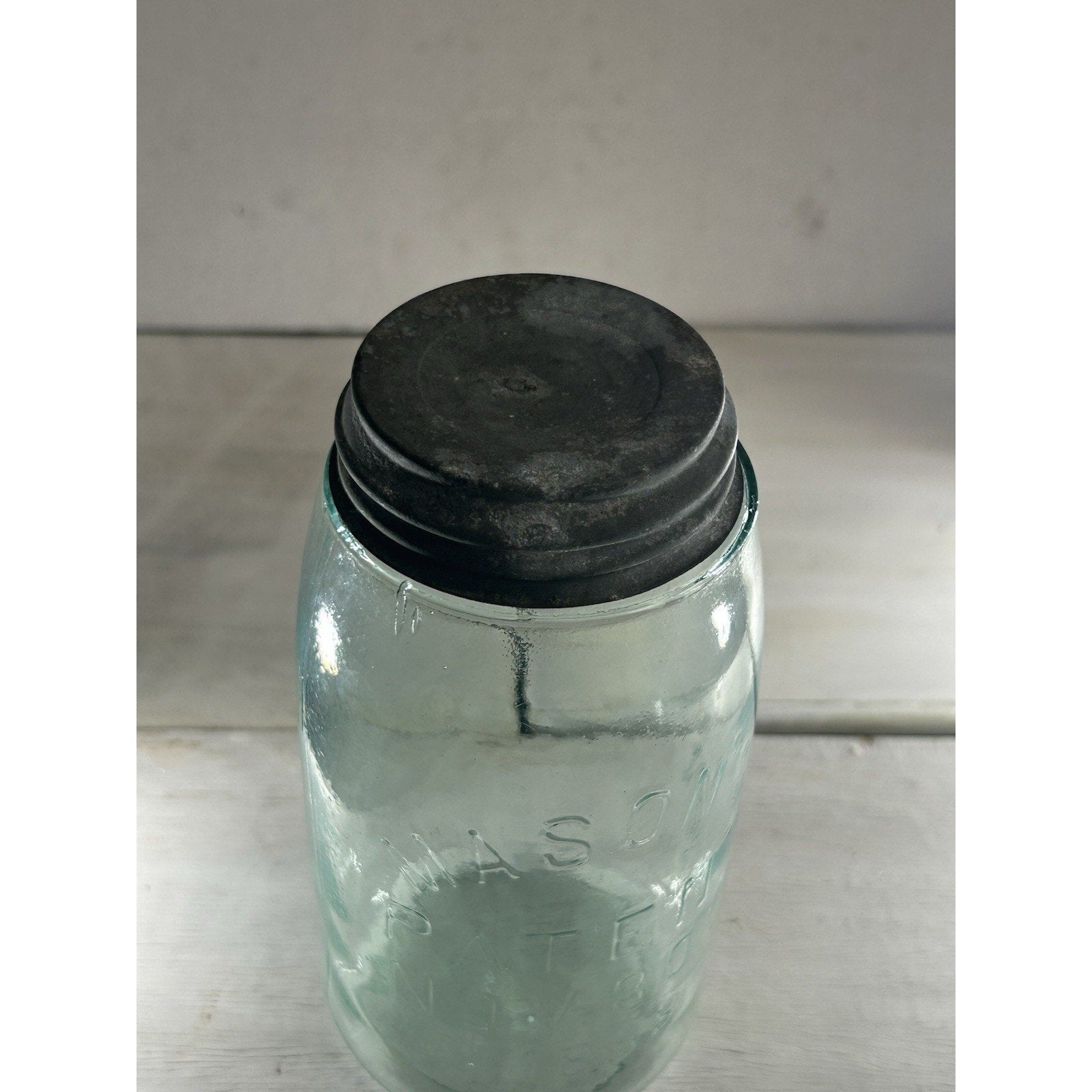 Mason's Patent Nov 30 1858 jar natural light — aqua glass tone with zinc lid, display-ready condition